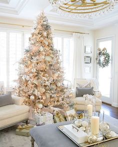 a white christmas tree in a living room