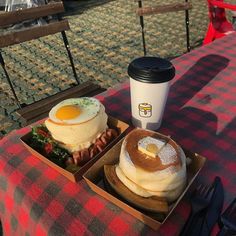 two breakfast foods are sitting on a picnic table