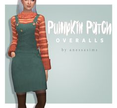 a woman in green overalls standing next to a white wall with pumpkin patch on it