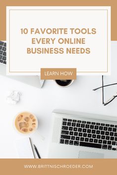 a laptop computer sitting on top of a white desk next to a cup of coffee