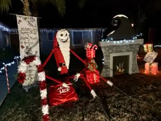 a yard decorated for christmas with decorations and lights