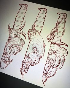 three drawings of dragon heads on a piece of paper