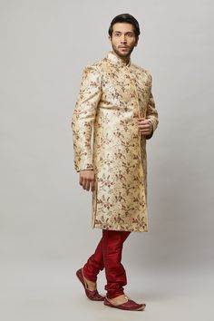 Men's floral embroidered sherwani with shades of Red, Blush & Sage in the flowers and petal Comes with a Red churidar Crafted with a collar neckline, full sleeves, and front button closure. Occasion: Can be worn to events like Sangeet, & Wedding WASH CARE INSTRUCTIONS - Please Dry clean only when it is applicable. Slight color variation is possible due to digital photography. Necklace not included Long Fitted Nehru Jacket With Floral Embroidery, Fitted Long Nehru Jacket With Floral Embroidery, Long Floral Embroidered Fitted Nehru Jacket, Long Fitted Kurta With Naqshi, Fitted Long Sherwani For Designer Wear, Fitted Long Kurta For Traditional Ceremonies, Gold Fitted Kurta For Traditional Ceremonies, Ceremonial Sherwani With Floral Embroidery, Gold Kurta For Traditional Ceremonies