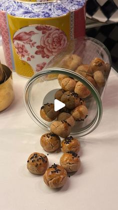 some food is laying out on a table next to a canister and other items