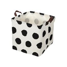 a black and white polka dot storage bag