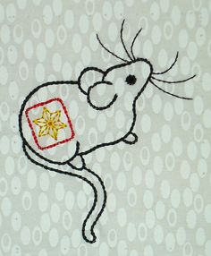 an embroidered mouse with a star on its chest