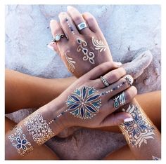 two women with tattoos on their hands