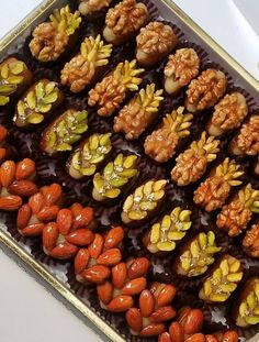 an assortment of nuts and other food items in a tray