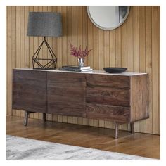 a sideboard with two drawers and a mirror on the wall