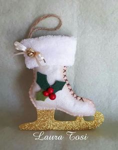 a christmas ornament with a pair of ice skates