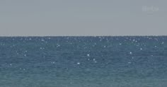 two people on surfboards in the ocean