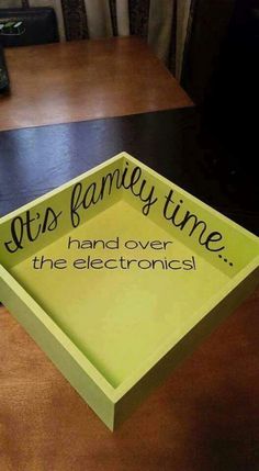 a green box with the words, it's family time hand over the electronics