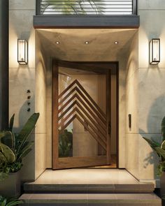 an entrance to a modern home with wooden doors