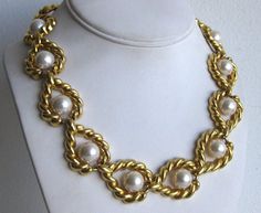 Beautiful vintage gold tone necklace with faux pearls measures 18" long x 1" wide. Unmarked and in excellent condition. Toggle clasp. Will ship worldwide. Thanks! Gold Chain Pearl Necklace Costume Jewelry, Gold Pearl Costume Jewelry Necklace, Gold Pearl Necklace With Chain, Costume Jewelry, Gold Chain Pearl Necklace In Costume Jewelry Style, Gold Pearl Necklace With Chain In Costume Style, Vintage Gold Pearl Necklace For Evening, Vintage Metal Pearl Necklace For Formal Events, Vintage Pearl Necklace With Chain For Parties, Vintage Formal Metal Pearl Necklace