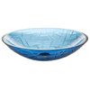 a blue glass bowl sitting on top of a white table