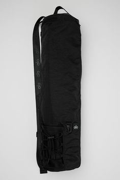 the back side of a black bag on a white background