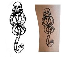 two temporary tattoos on the arm and one with a skull, snake, and snake