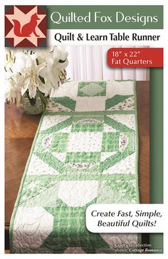 a quilted table runner with flowers in the center and text that reads quilted fox designs quilt & learn table runner