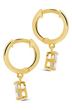 Faceted cubic zirconia drops draw the eye to huggie-hoop earrings finished in warm 14-karat-gold plating. 0.45" width; 0.75" drop Hinge with snap-post closure 14k-gold plate/cubic zirconia Imported Gold Teardrop Huggie Earrings In Cubic Zirconia, Gold Teardrop Huggie Earrings With Cubic Zirconia, Earrings In Gold, Huggie Hoop Earrings, The Eye, Gold Plating, Nordstrom Rack, Cubic Zirconia, Gold Plate