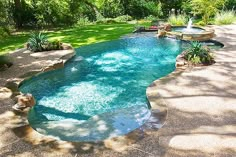 an outdoor swimming pool in the middle of a yard with lounge chairs and trees around it