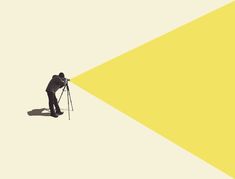 a man standing in front of a yellow and white background with a camera on his tripod