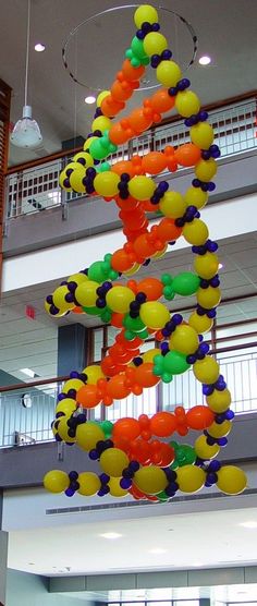 a multicolored balloon sculpture hanging from the ceiling