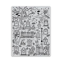 a rubber stamp with halloween scenes and tombstones