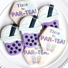 decorated cookies on a plate with words time to par - tea