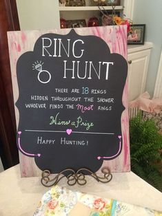 a sign that says ring and hunt on the side of a table with other items