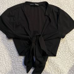 Shein Black Crop Top. Size Xs. Never Worn. Can Be Tied In Multiple Different Ways. Never Worn. Black Stretch Top With Tie Back, Elegant Black Top With Tie Back, Fitted Casual Crop Top With Tie Waist, Casual Fitted Crop Top With Tie Waist, Fitted Black Top With Tie Waist, Fitted Tied Tops For Party, Fitted Tied Top For Parties, Black Tie Waist Top For Spring, Fitted Party Top With Tied Detail