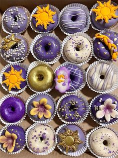 a box filled with lots of different types of doughnuts on top of each other