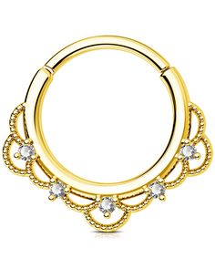 a gold plated circular nose ring with crystal stones on the sides and an intricate design