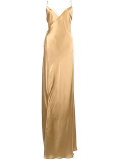 Gold-tone silk satin strappy wrap gown from Michelle Mason featuring spaghetti straps, a V-neck, an open back, a side tie fastening, a flared skirt, a front slit and a long length. Gold Silk Dress, Women Silk Dress, Silk Prom Dress, Gown Gold, Bridal Party Outfit, Michelle Mason, Silk Dress Long, Silk Gown, Flared Skirt