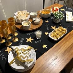 a table topped with plates and bowls filled with food