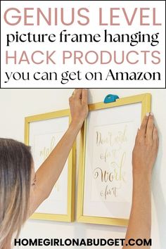 a woman is hanging pictures on the wall with text overlay that reads genius level picture frame hanging hack products you can get on amazon