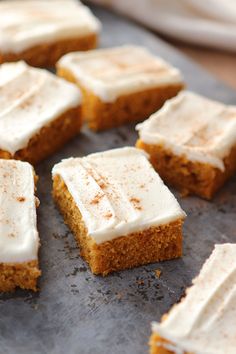 several pieces of cake sitting on top of a baking sheet