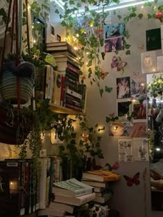 a room filled with lots of books and plants on top of shelves next to each other