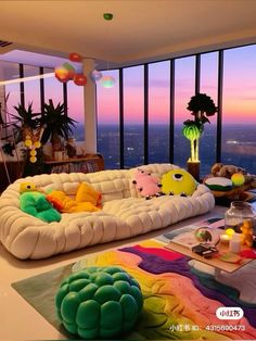 a living room filled with lots of furniture next to a window covered in colorful balloons