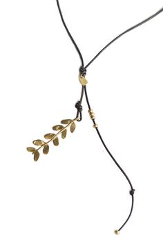 The Large Laurel Necklace,is the perfect balance between elegance and ease. A long sculpted brass pendant hangs on a strong leather cord adorned with brass beads and other sculpted details. You can also choose a beaded bone option for even more flair. Each necklace is hand-made and hangs at 36". A stunning yet relaxed piece, expertly crafted with intricately sculpted laurel details. Solid jewlers brass. Laurel is 3.5' long and 1" wide. Laurel Necklace, Brass Beads, Bone Beads, Brass Pendant, Leather Cord, Hand Made, Brass, Beads, Pendant