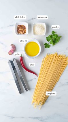 ingredients to make pasta laid out on a table