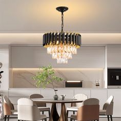 a dining room table with chairs and a chandelier hanging from it's ceiling