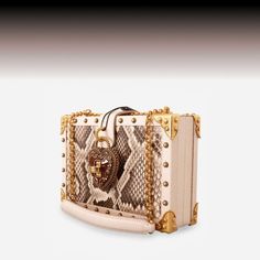 Carry yourself with confidence and style with a Dolce and Gabbana handbag. Because every woman deserves to feel like a queen! With Love We Stride sendegaro.com #DolceGabbana #sendegaro #designerclothing #designerswear #dolcegabbanashoes #dolcegabbanabag #dolcegabbanadress #dolcegabbanawomen #dolcegabbanamen #dolcegabbanastyle #effortlessfashion Python Skin, Dolce Gabbana Shoes, Dolce Gabbana Dress, Heart Box, Handbags Women, Dolce And Gabbana Man