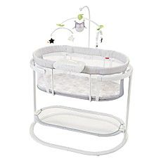 the baby crib is white and has blue trimmings on it's sides