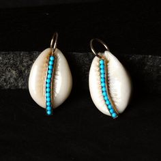 Cowrie shell is very popular these days. It's unique shape is much more inspirable to make it statement piece of adornments.  you can have one or more. but it is must have piece of jewelry. It is made with solid 14k Yellow gold. It can be a perfect gift for yours's or yourself. You can contact me if you have any query about anything.  Have a FINE ADORNMENT!! :) ✦ This is the perfect gift for mom, wife, fiancée, girlfriend, valentine, daughter, family or friend. It is a special gift for mother's day, valentine's day, wedding, anniversary, birthday, Christmas, Easter, New Year's and any holiday. ✦ Custom Orders : Since most products are handmade and made by members of my shop , you can ask us any kind of customization. You can choose from 14k Gold, 925 Silver And Diamond. For most of the ite Turquoise Beaded Shell Jewelry, Turquoise Shell-shaped Jewelry For Vacation, Blue Shell-shaped Jewelry For Vacation, Bohemian Blue Shell-shaped Jewelry, Bohemian Beaded Jewelry For Holidays, Bohemian Beaded Holiday Jewelry, Holiday Bohemian Beaded Jewelry, Blue Shell-shaped Jewelry For Gift, Gift Turquoise Beaded Shell