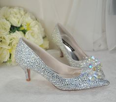 Cinderella Wedding Shoes, Swarovski Crystal Bridal Shoes, Kitten Heels, Handmade Rhinestone Shoes for Bride, Flower Crystal Shoe Clips Design Details: * Handmade Satin Bridal Shoes with cushioned insoles. * Heel Height: 5cm * Colour Availability: Silver * Choice of Preciosa or Swarovski Crystal * Court Shoes * Kitten Heel * Pointed Toe * Crystal Flower on Toe Customisation Availability: (Please message me to discuss your custom requirements)  * Crystal Finish - Preciosa or Swarovski  * Colour * Cinderella Wedding Shoes, Shoes Kitten Heels, Cinderella Heels, Shoes For Bride, Bride Flower, Princess Bridal, Cinderella Wedding, Kitten Heel Shoes, Flower Crystal