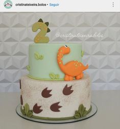 there is a dinosaur cake on the table