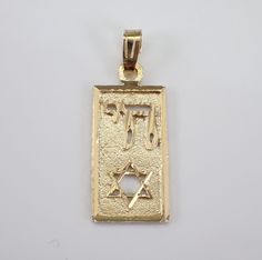 Vintage 14K Yellow Gold Star of David and Chai Charm Pendant. This charm is Solid 14K Yellow gold and weighs 1.7 grams. This pendant measures 19.5 X 10.5 mm without the bail. I will ship this pendant promptly in a gift pouch. Yellow Gold Star Of David Charms Jewelry, Star Of David Polished Jewelry For Anniversary, Star Of David Jewelry Polished Finish For Anniversary, Symbolic Star Of David Engraved Jewelry, Stamped 14k Gold Spiritual Jewelry And Charms, Formal Yellow Gold Star Of David Jewelry, Yellow Gold Star Of David Jewelry For Formal Occasions, 14k Gold Star Of David Jewelry For Anniversary, Symbolic 14k Gold Jewelry For Commemoration