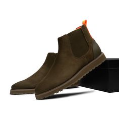 Casual Men Suede High Top Suede Chelsea Boot. Made With Premium Breathable Suede Fiber Upper. Made With Soft Lycra Lining And Removable Soft Eva Insole For Comfort. Toe Shape Round Pattern Snake Closure Slip On Width Standard Upper Mat Microfiber Upper Color Olive Lining Mat Lycra Lining Color Orange Insole Mat Eva Insole Color Orange Welt Mat Rubber Welt Color Olive Sole Mat Foam. Sole Color Olive Casual Slip-on Chelsea Boots With Cushioned Footbed, Casual Cushioned Slip-on Chelsea Boots, Casual Chelsea Boots With Suede Lining For Winter, Casual Suede Chelsea Boots For Outdoor, Winter Casual Chelsea Boots With Suede Lining, Pattern Snake, Chukka Sneakers, Twisted X Boots, Suede Chukka Boots