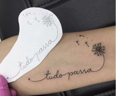 a woman's arm with a dandelion tattoo on it and the word utopia written in cursive writing