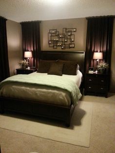 a bedroom with a bed, nightstands and lamps